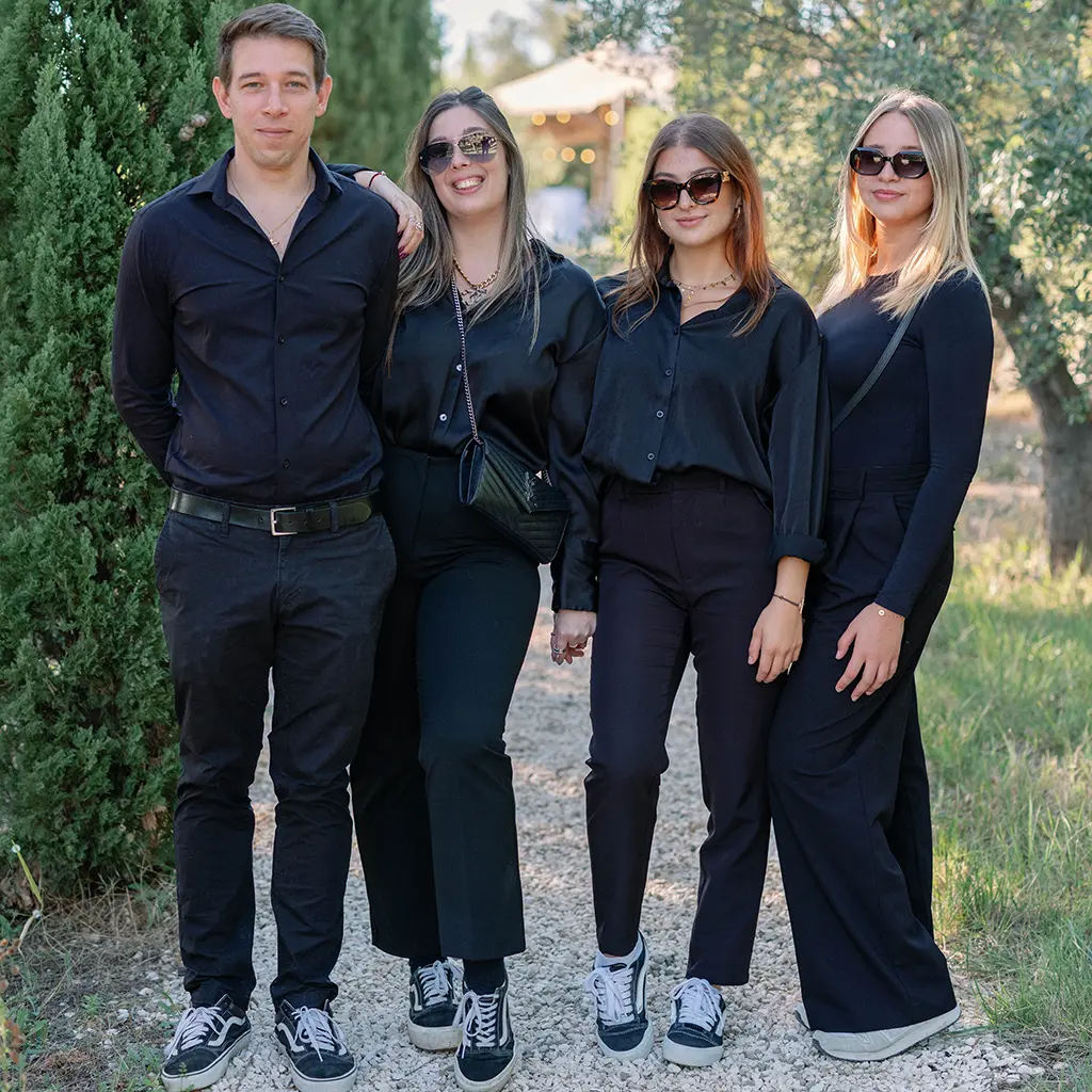 Group of four people in black